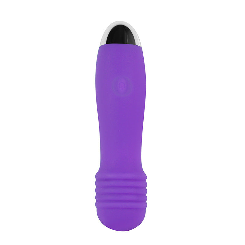 Close-up of compact wand massager showing soft silicone head