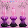 Large fantasy dildo displayed against plain background