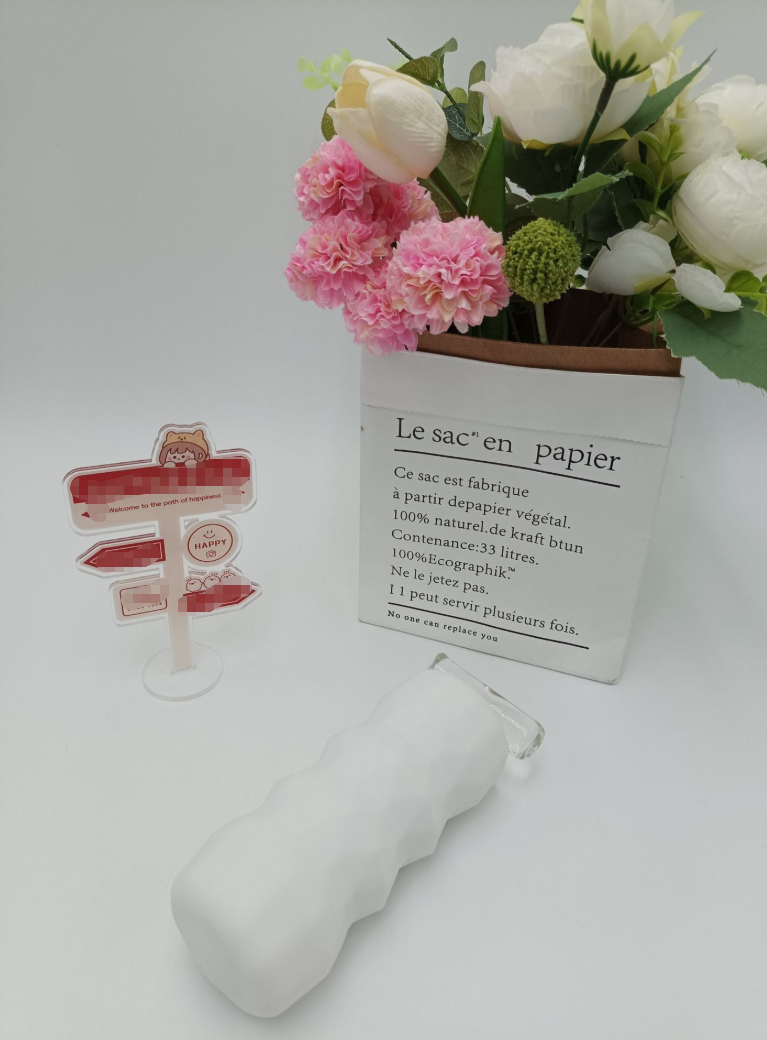 Discreet desktop scene — airplane cup masturbator placed on table with decor for low-key storage (lifestyle photo)