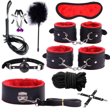 Bondage handcuffs set shown with soft padded cuffs and connection strap
