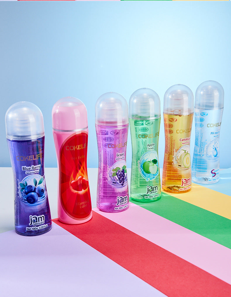 Peach flavored water-based lubricant shown upright with clear bottle