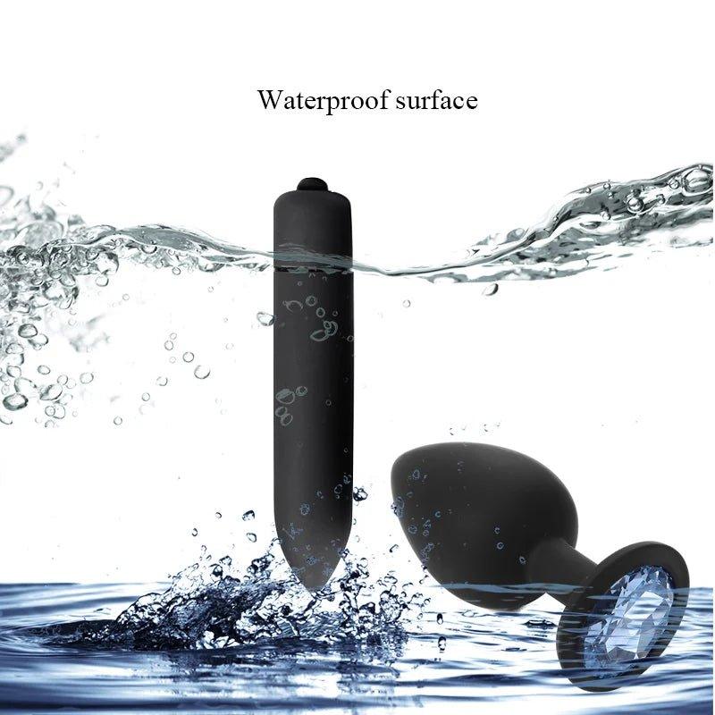 Side angle of silicone butt plug and mini vibrator highlighting smooth texture