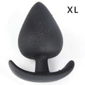 Silicone anal plug set displayed upright in four sizes