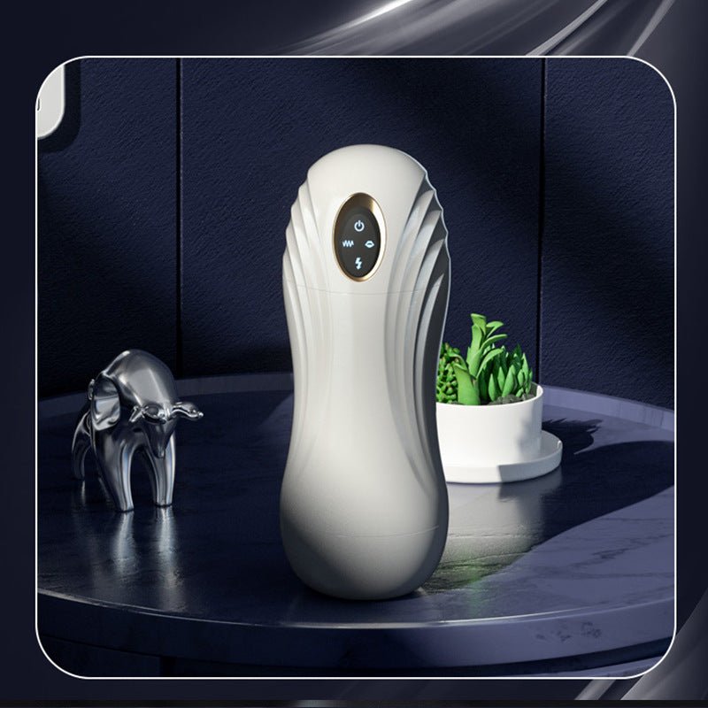 Automatic male masturbator shown in front view with clear inner sleeve