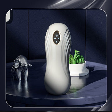 Automatic male masturbator shown in front view with clear inner sleeve