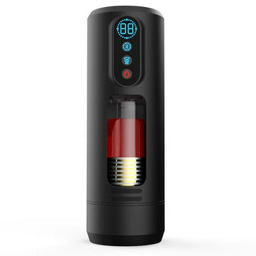 Side angle of vibrating and thrusting male masturbator showing clear sleeve