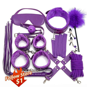 Leather BDSM kit with handcuffs, collar and whip displayed together